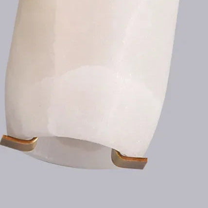 Alabaster tube pendant light bottom end with warm brass base details