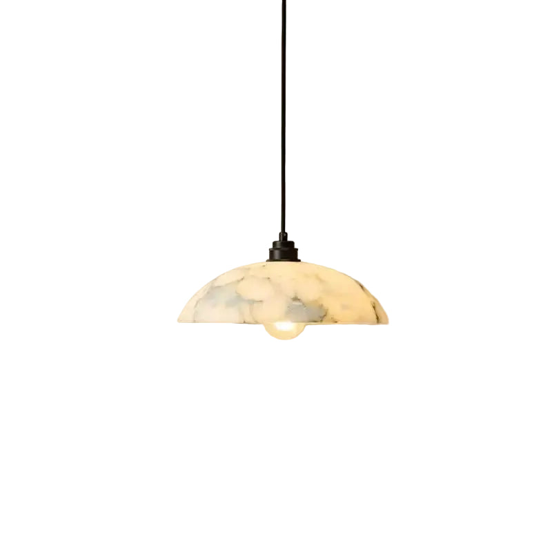 Alabaster domed pendant light with black cord and warm bulb glow