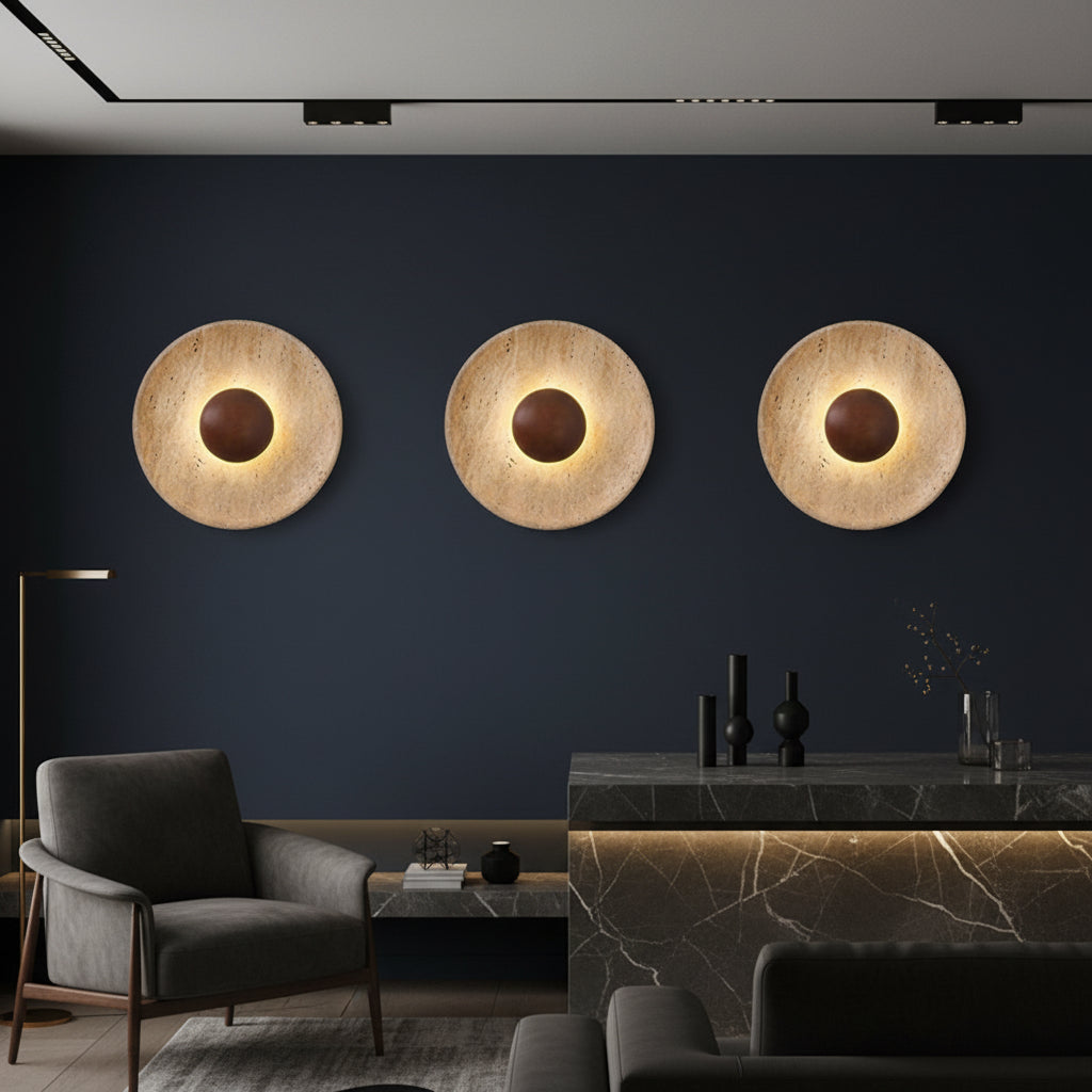 Set of three round backlit wall lights with textured stone discs and dark centers