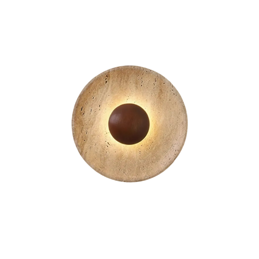 Round backlit wall sconce with textured stone disc and warm glow around dark center
