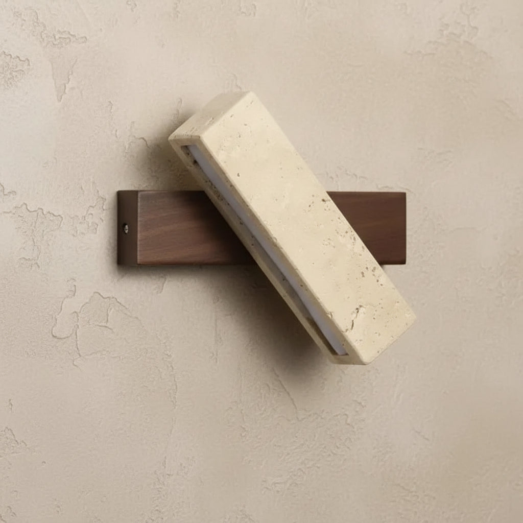 Rotatable long bar wall sconce with speckled travertine diffuser and dark wood backplate