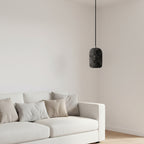 Concrete cylindrical pendant light with speckled dark shade and black cord