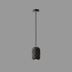 Concrete cylindrical pendant light with speckled dark shade and black cord
