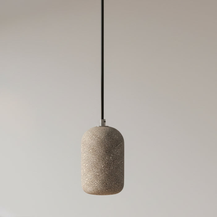 Concrete cylindrical pendant light with speckled gray shade and black cord