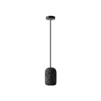 Single concrete cylindrical pendant light with speckled dark shade and black ceiling mount