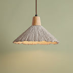 Fluted cone pendant light with light wood canopy and scalloped textured cone shade