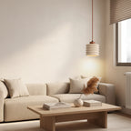 Ribbed travertine pendant light with cylindrical shade, hanging from a brown cord