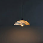 Alabaster domed pendant light with black cord and marble-pattern shade