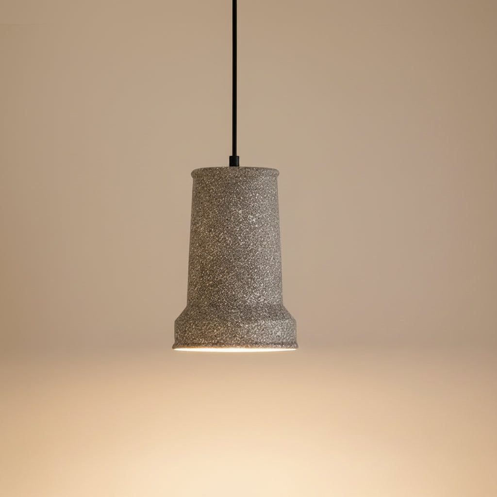White terrazzo stepped cone pendant light with black cord and top canopy