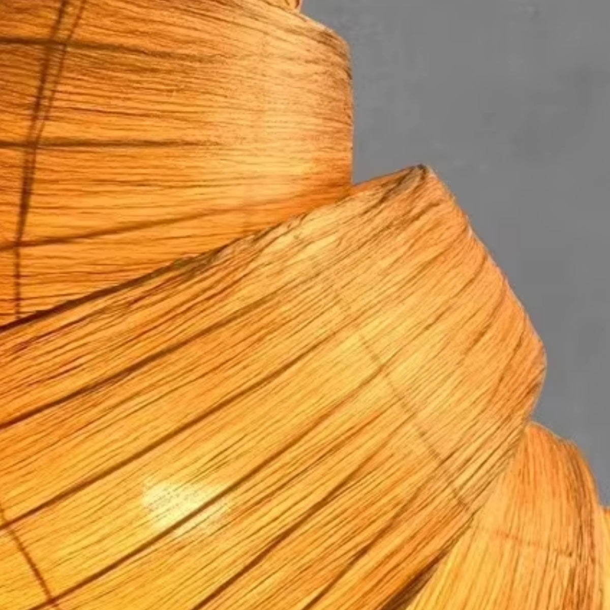 Close-up of brown woven pendant light shade showing layered weave lines