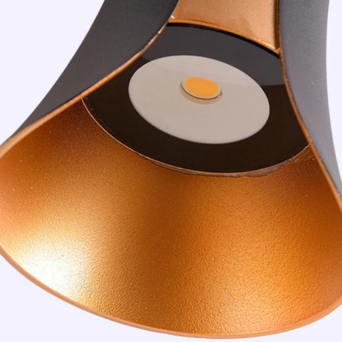 Up-and-down wall light detail: black ring with glowing round center