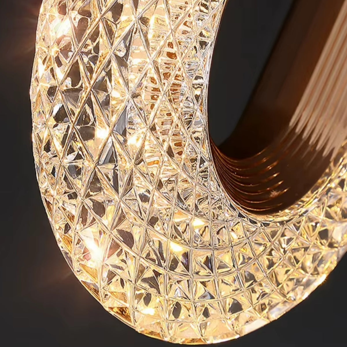 Close-up of the gold textured oval lamp cover with diamond pattern surface