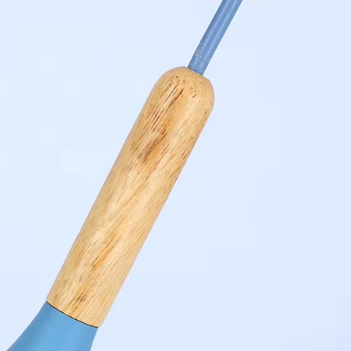 Close-up of light wood top mount and blue dome shade on a pendant light