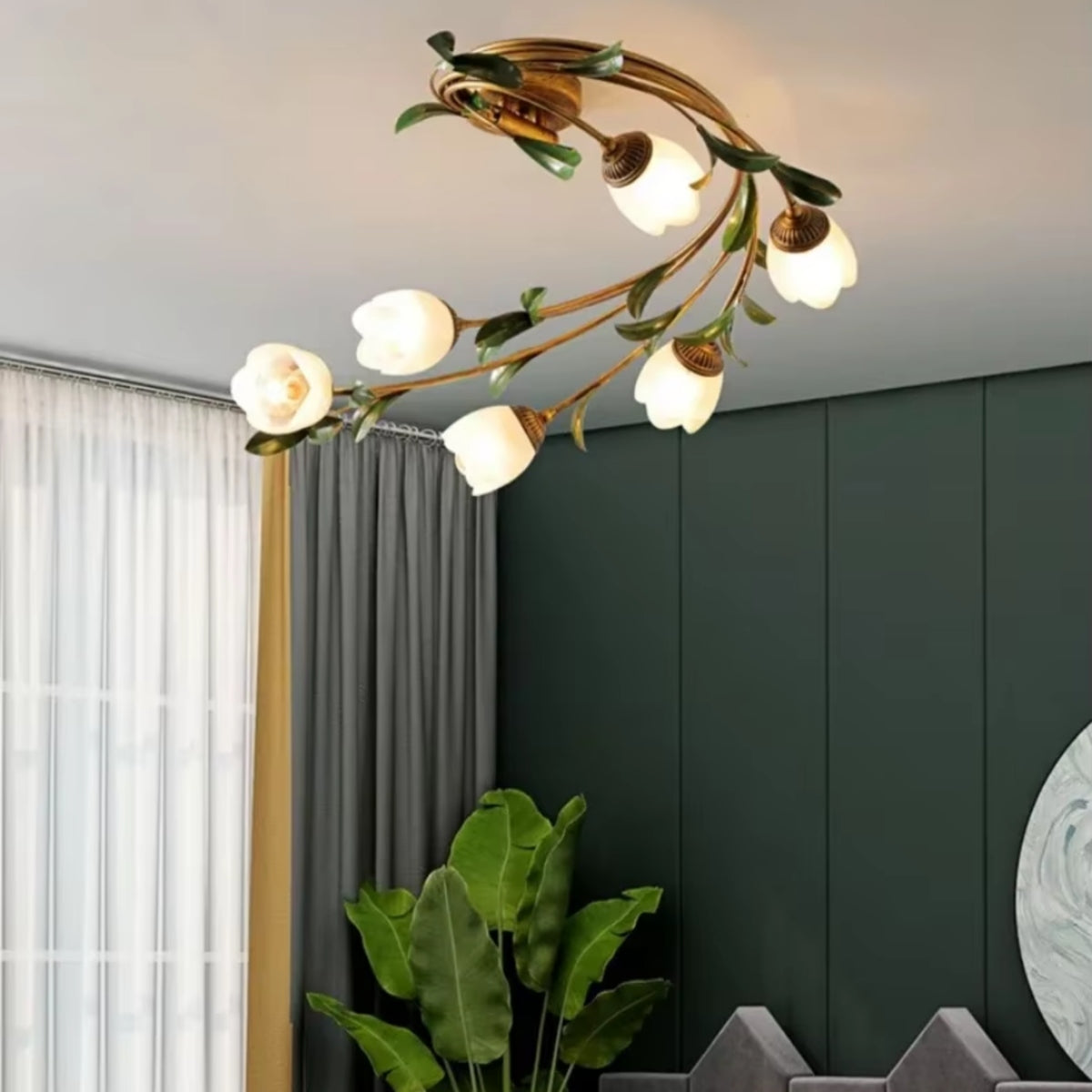Ceiling light with gold circular frame, leafy branches, and multiple opal glass shades
