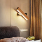 Rotatable arm wooden wall light with warm LED glow, mounted near curtains and sofa