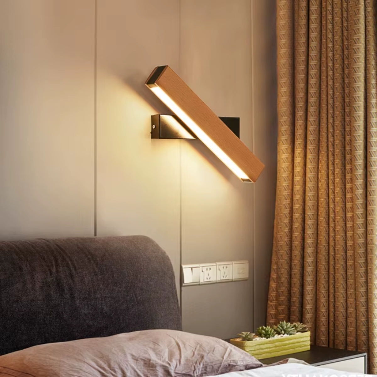 Rotatable arm wooden wall light with warm LED glow, mounted near curtains and sofa