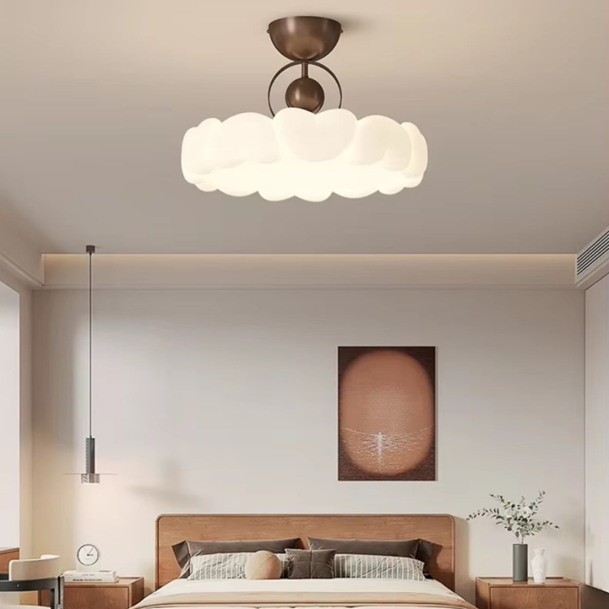White scalloped petal ceiling light with bronze canopy above a bed