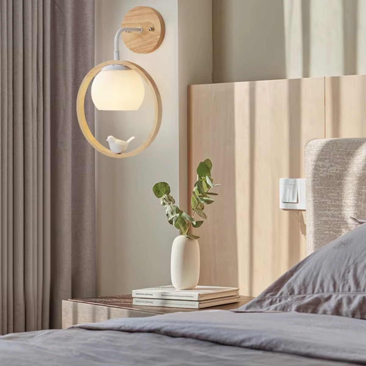 Wood halo bird wall light with lit globe bulb and bird ornament in circular ring