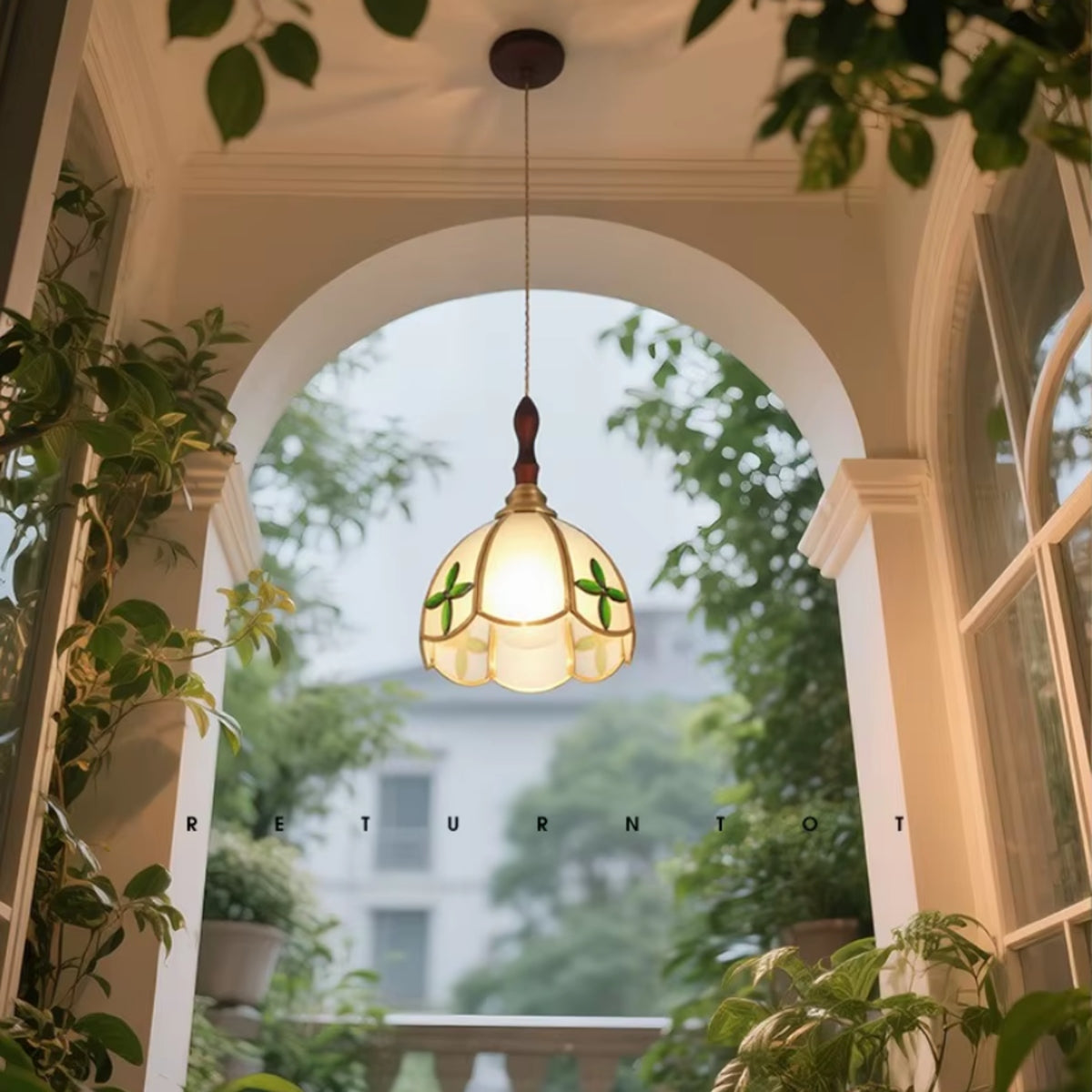 Scalloped stained-glass pendant light with green-and-cream shade and leaf details