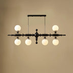 Black linear spindle-ball chandelier with 4 frosted glass globe lights