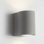 D-shaped wall light with smooth dark-gray housing and circular lit LED opening
