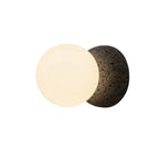 Globe wall light with frosted glass globe and textured concrete mounting plate