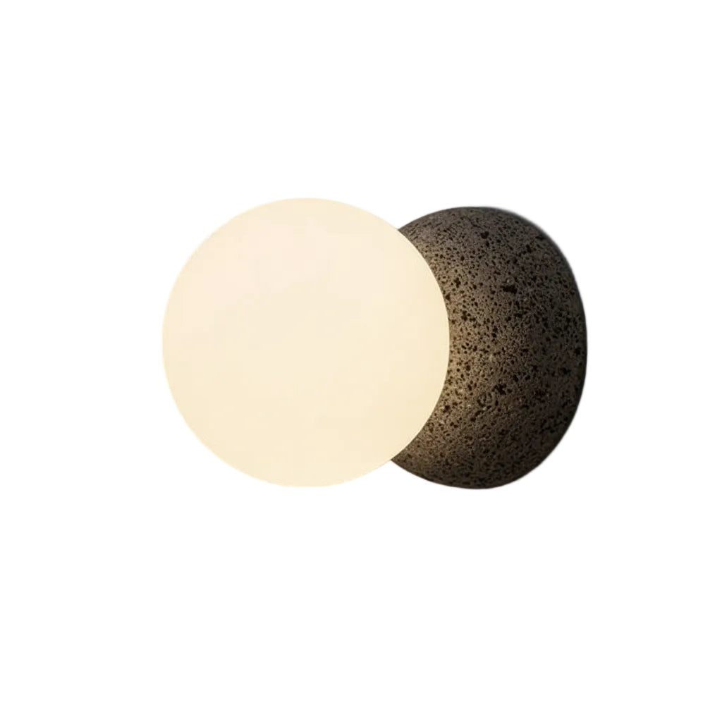Globe wall light with frosted glass globe and textured concrete mounting plate