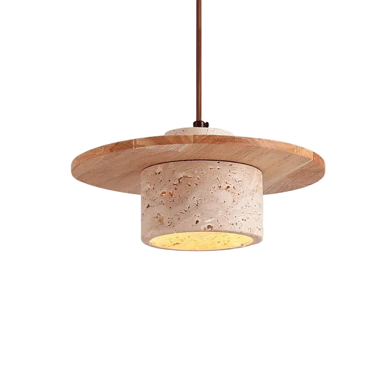 Layered pendant light with travertine-toned disc shade and warm recessed bulb