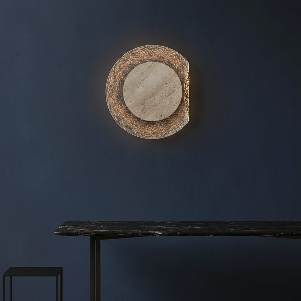 Round travertine backlit wall sconce with textured outer ring and grey inner disc
