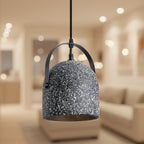 Black speckled bell pendant light with black metal arch and warm gold underside.