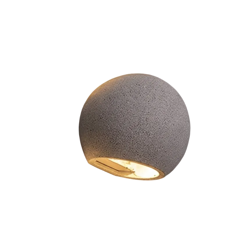 Oval concrete wall light with textured globe shade, warm beam through oval opening