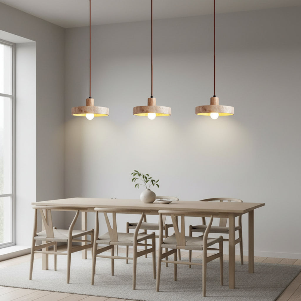 Kivor round travertine pendant light set of three with warm lit bulbs