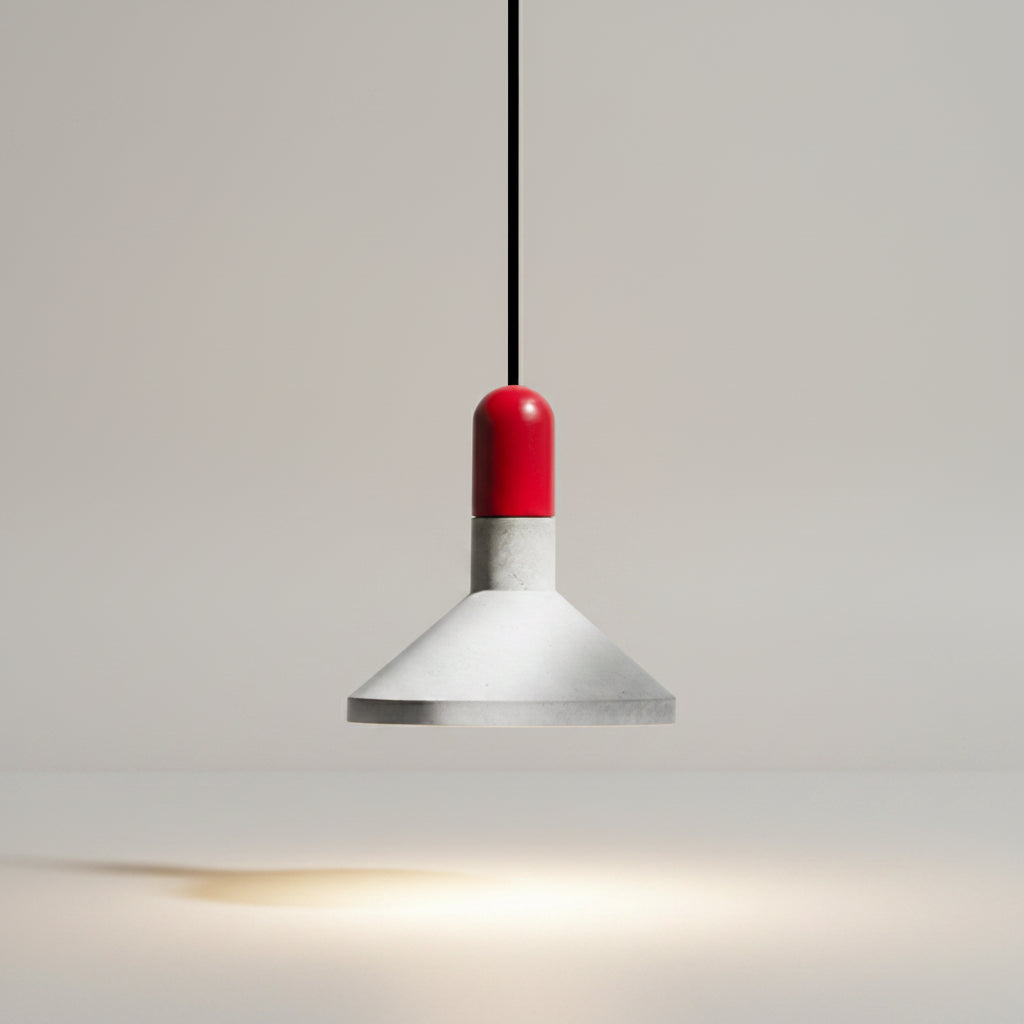 Conical pendant light with red cap, white metal shade, and soft warm light