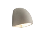 Half-dome wall light with concrete-like gray shade and warm LED glow