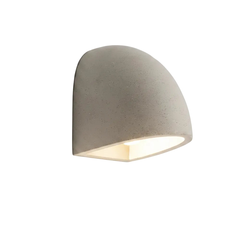 Half-dome wall light with concrete-like gray shade and warm LED glow